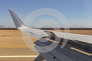The plane lands on the airfield. Spoilers and flaps trailing edge when landing. photo