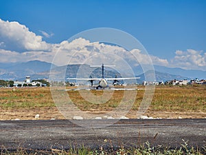 A plane of local, Nepalese airlines on the runway of the airport in Pokhara