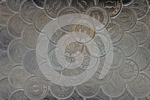 Plane of many Japanese coins at 1 yen. Dark background or wallpaper. News about the economy, finances and interest rate of the