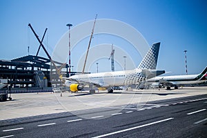 Plane is parked, loading baggage in aircraft