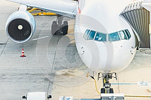 Plane parked at runway in airport