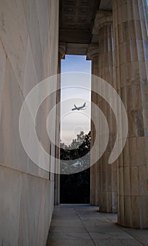 Plane passing the Lincoln Memorial in Washington DC, USA