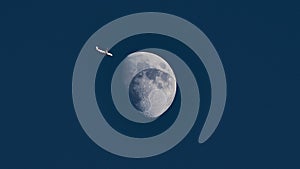 Plane passing moon