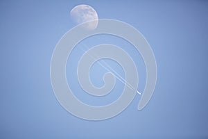 the plane passing by the moon