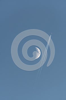 Plane passing near the moon