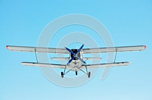 Plane with a propeller in the sky close-up