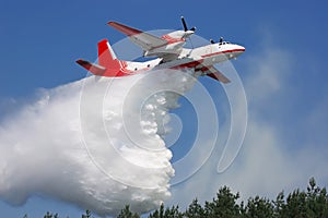 The plane puts out the fire with water.