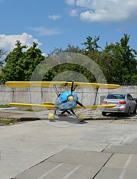 Small plane on the runway, airplane barn