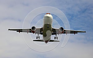 A plane from the side approaching for landing.