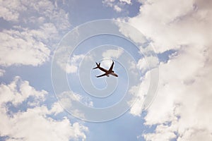 Plane silhouette in beautiful blue sky