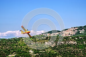The plane in the sky over the town of Nemi in the vicinity of Rome. Italy.