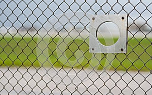 Plane spotter airport fence viewing hole