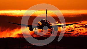 Plane spotting at Otopeni airport during sunset with red sky photo