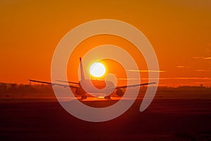 Plane in sunset