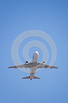 Plane Taking Off into Clear Blue Sky