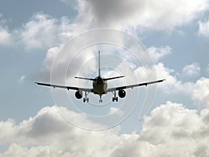 Plane taking off into the sky with dense clouds