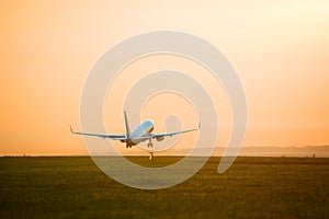 Plane taking off sunset