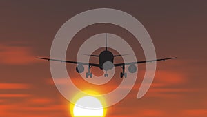 The plane is taking off at sunset