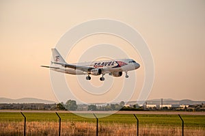 Large airliner just before landing in the evening at sunset.