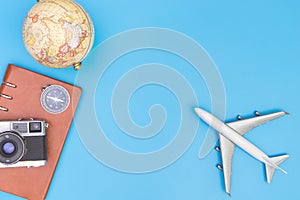 Plane toy and travel objects on blue for travel concept