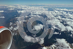 Plane view of mountains and clouds. Caucasus, Krasnodar Territory, Russia