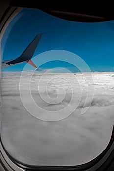 Plane window, spectacular sky