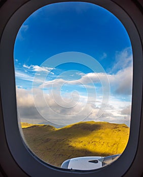 Plane window view of landing at Vagar airport on Faroe Islands photo