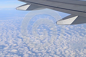 plane wing with cloud and sky