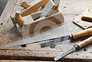 planes and chisels and a saw on the Workbench inside the craftsman joinery manufacturer