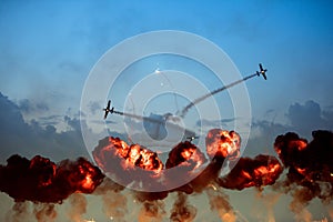 Planes doing tricks during high explosive flames rise up photo