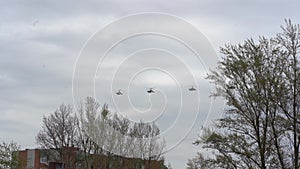 planes flies in the sky above multi-storey apartment buildings