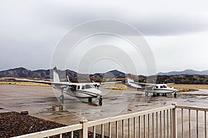 Planes parked at an Airport.