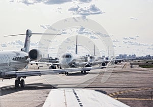 Commercial airliners waiting for takeoff