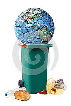 Planet destroying conceptual picture, planet Earth is trown into garbage, deiscarded food, waste