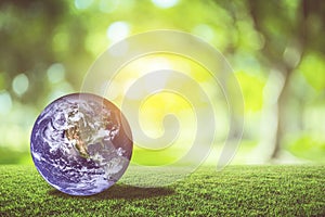 Planet earth beautiful on green grass with nature blur bokeh background