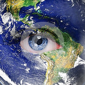 Planet earth and blue human eye