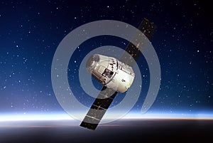 Planet Earth and cargo space ship on orbit.