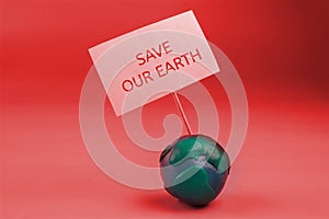 the planet earth in danger concept. earth holding a banner