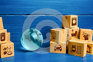 Planet Earth globe and cardboard boxes mass consumption products. Delivering goods around the world. International trade