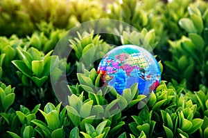 Planet earth model in green plants