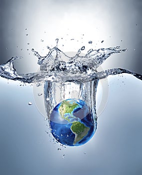 Planet Earth, splashing into water. photo