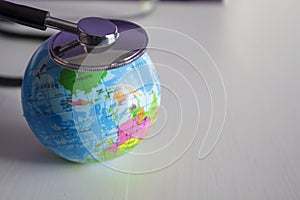 Planet earth and stethoscope. Global healthcare concept