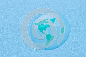 Planet earth in a water drop