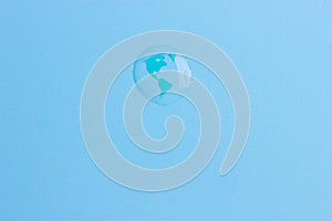 Planet earth in a water drop