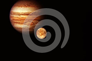 Planet Jupiter  with a large satellite on a dark background. Elements of this image were furnished by NASA