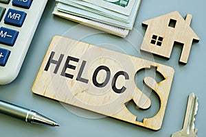 Plank with sign HELOC Home Equity Line of Credit