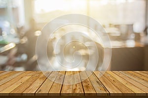 Plank wooden table top and blurred abstract background from interior building banner backdrop with desk blur, counter work people