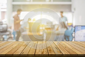 Plank wooden table top and blurred abstract background from interior building banner backdrop with desk blur, counter work people