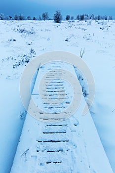 Planked footpath in the snowy High Vens, Belgium