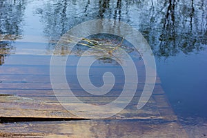 Planked footway under water.